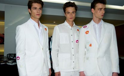 Three male models wearing white
