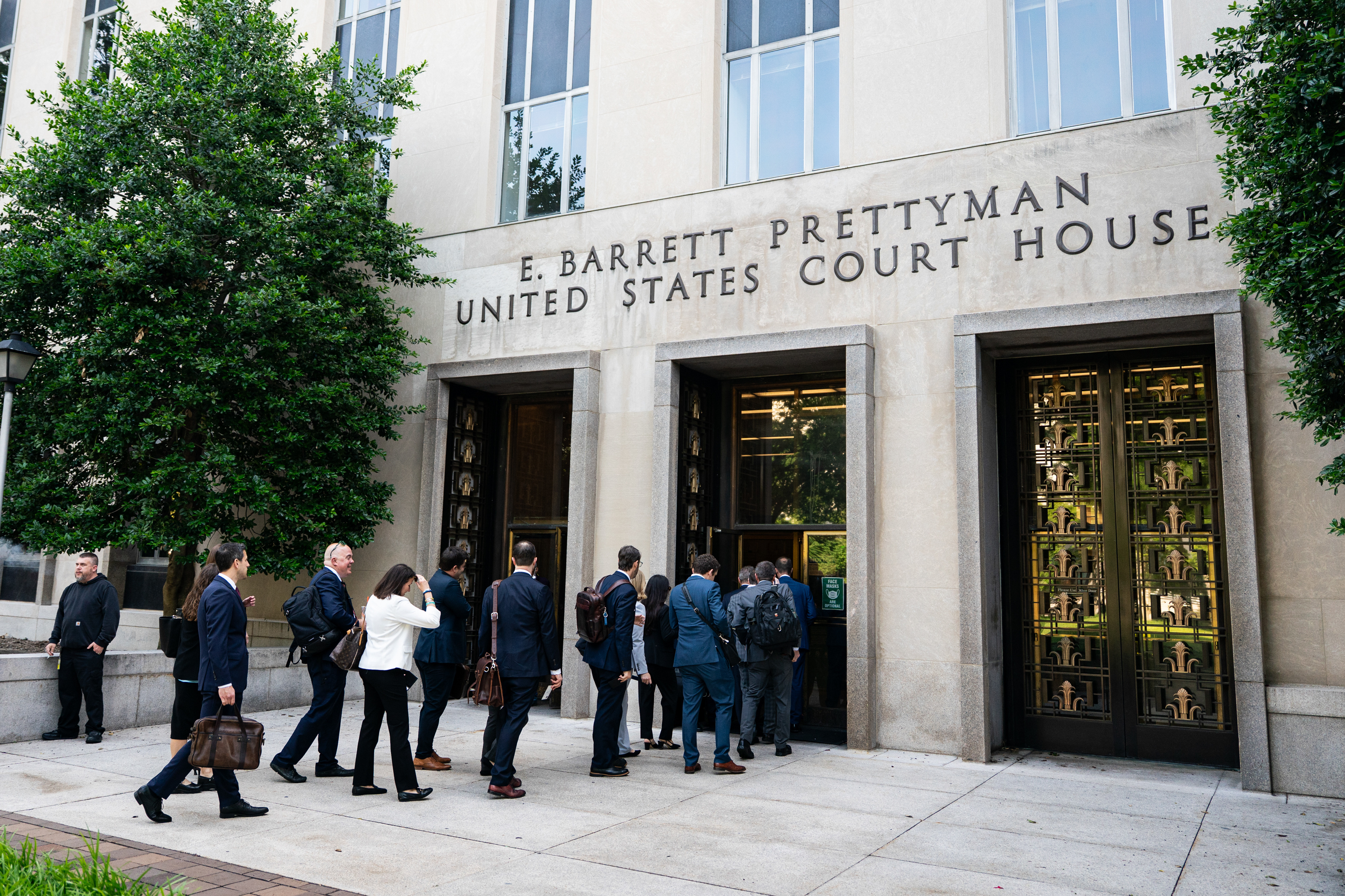 Members of the antitrust division of the US Department of Justice arrive at federal court in Washington, DC, US, on Friday, May 30, 2025. Google and the US Department of Justice offer closing arguments Friday in the remedy phase of a trial over the tech giant's search monopolization. Photographer: Al Drago/Bloomberg via Getty Images