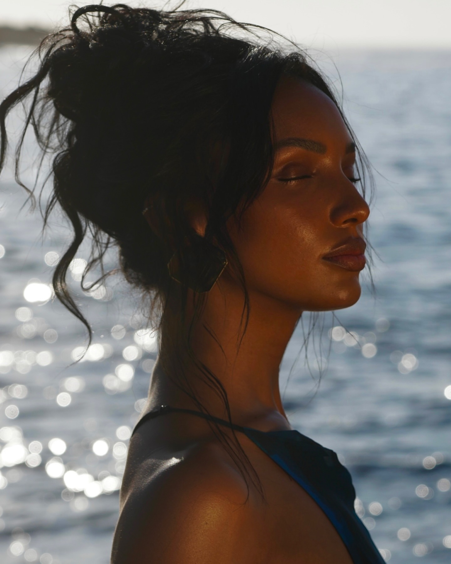 Jasmine Tookes with wavy bun updo