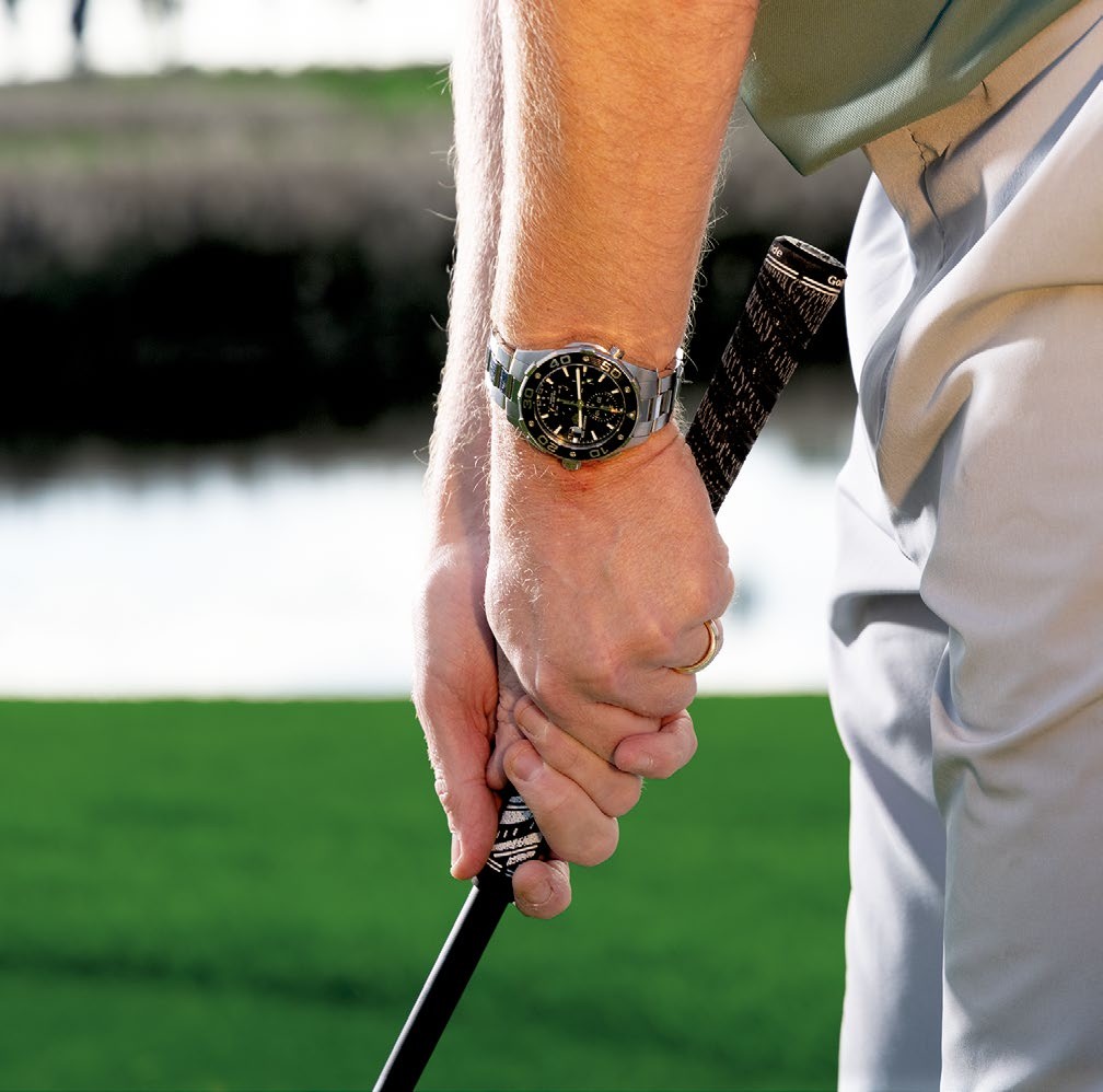 Ged Walters gripping down on the hybrid as the shaft is longer than a wedge when playing a chip shot around the green