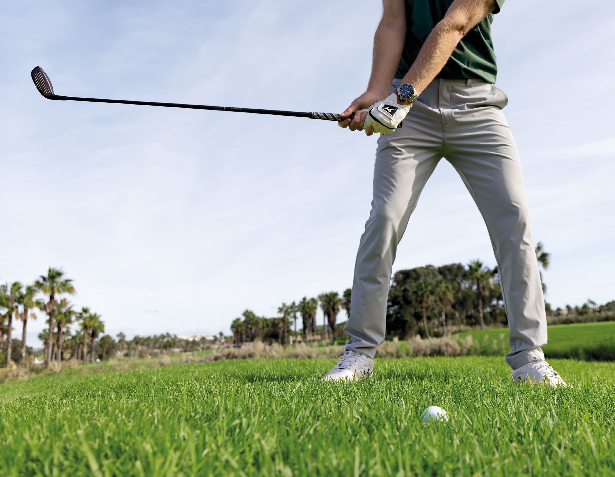 Ged Walters demonstrating the correct wrist set for a downward angle of attack out of the rough with a hybrid