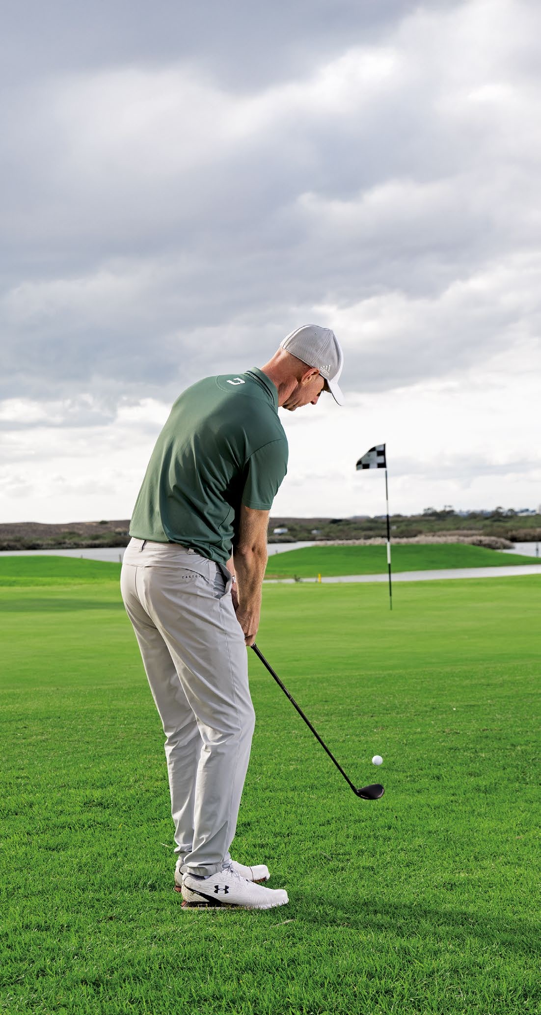 Ged Walters hitting a greenside chip shot at Salgados Golf Club in Portugal