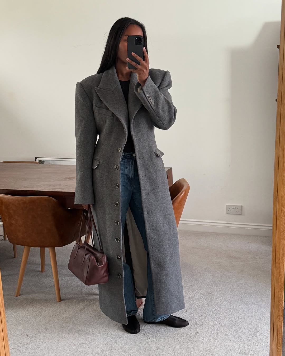 woman wearing winter denim outfit idea 2025