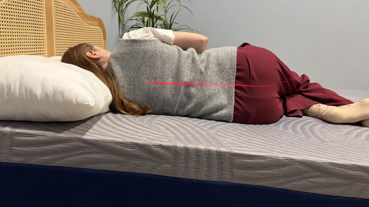 A mattress tester side sleeping on the SweetNight CoolNest Mattress.