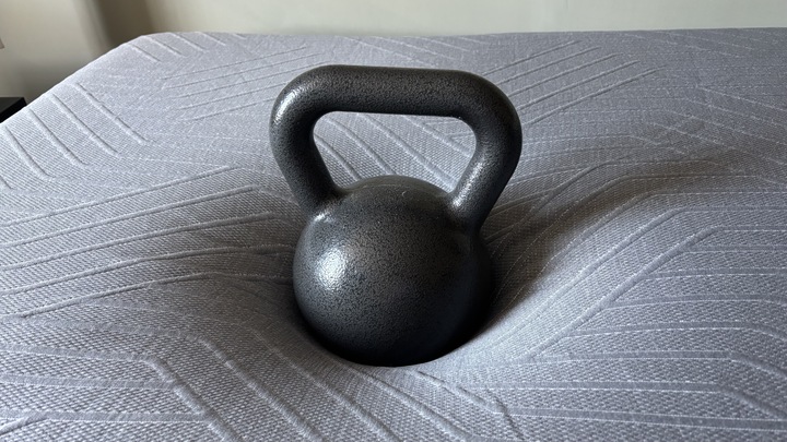 A weight sits on the EGOHOME Black 12