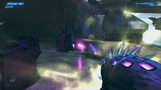 The player fires the Needler at an enemy in Halo