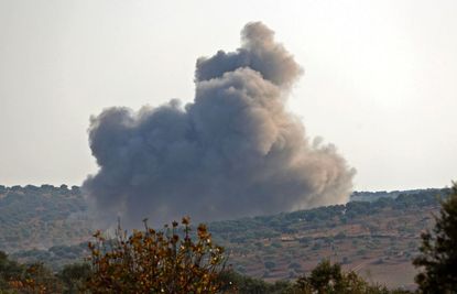Smoke billows after an airstrike in Syria.