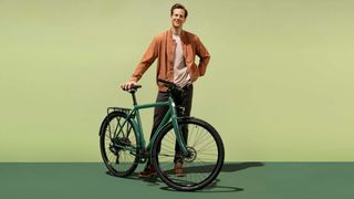 Man standing with Ampler Stout e-bike