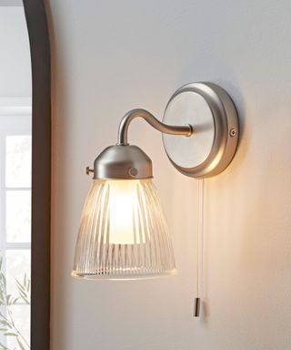 wall light with fluted glass and steel