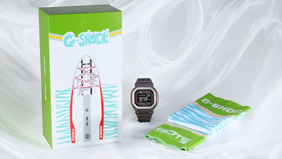 Casio G-Shock watch with neck gaiter and paddle board in box