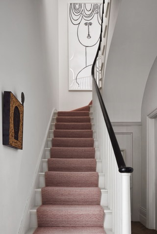 blush pink stair runner on white painted staircase