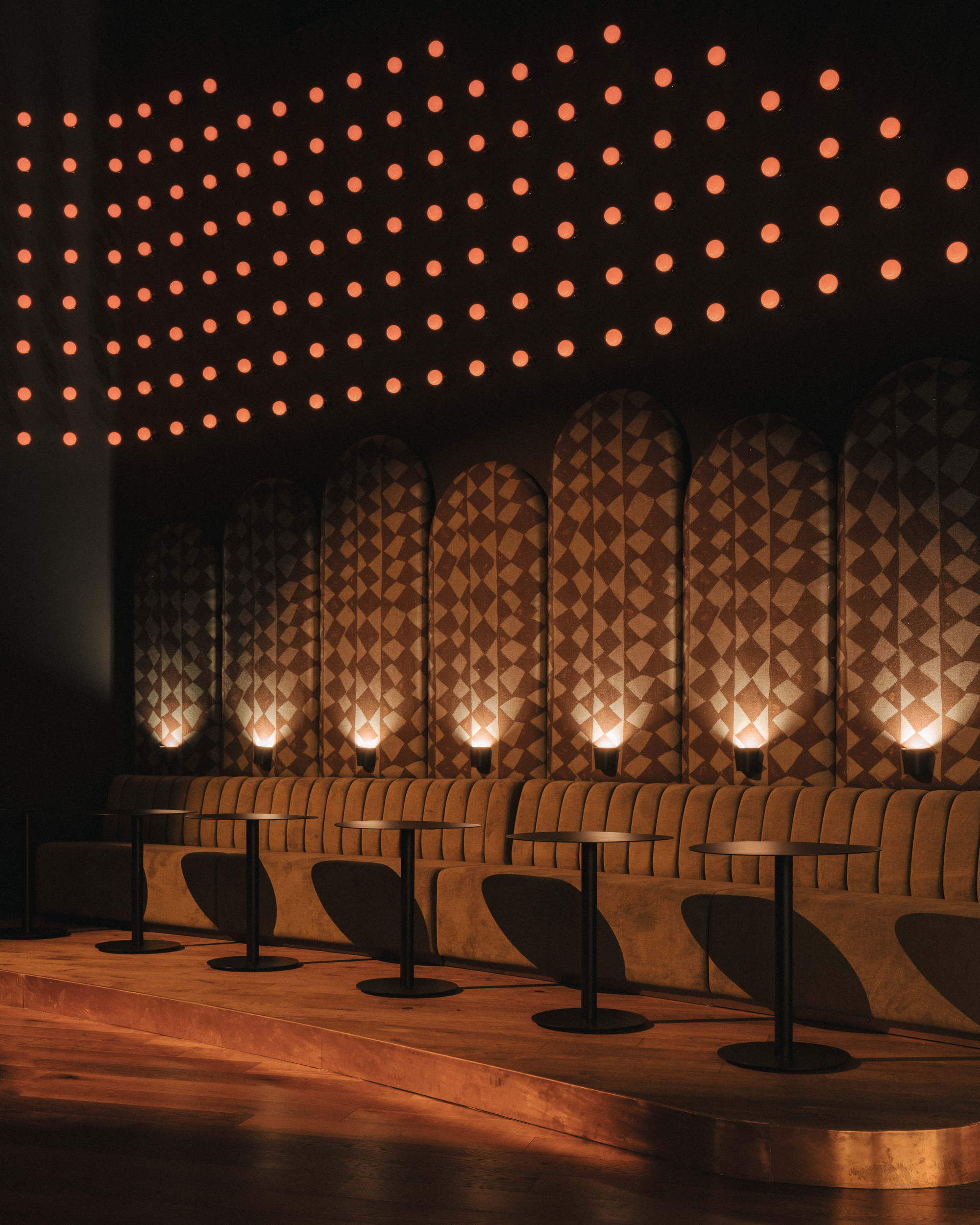 A series of pictures depicting the interior and exterior grounds of a sprawling resort, immersed in nature, between vineyards, gardens, and spa pools, and decorated with crafty artifacts.