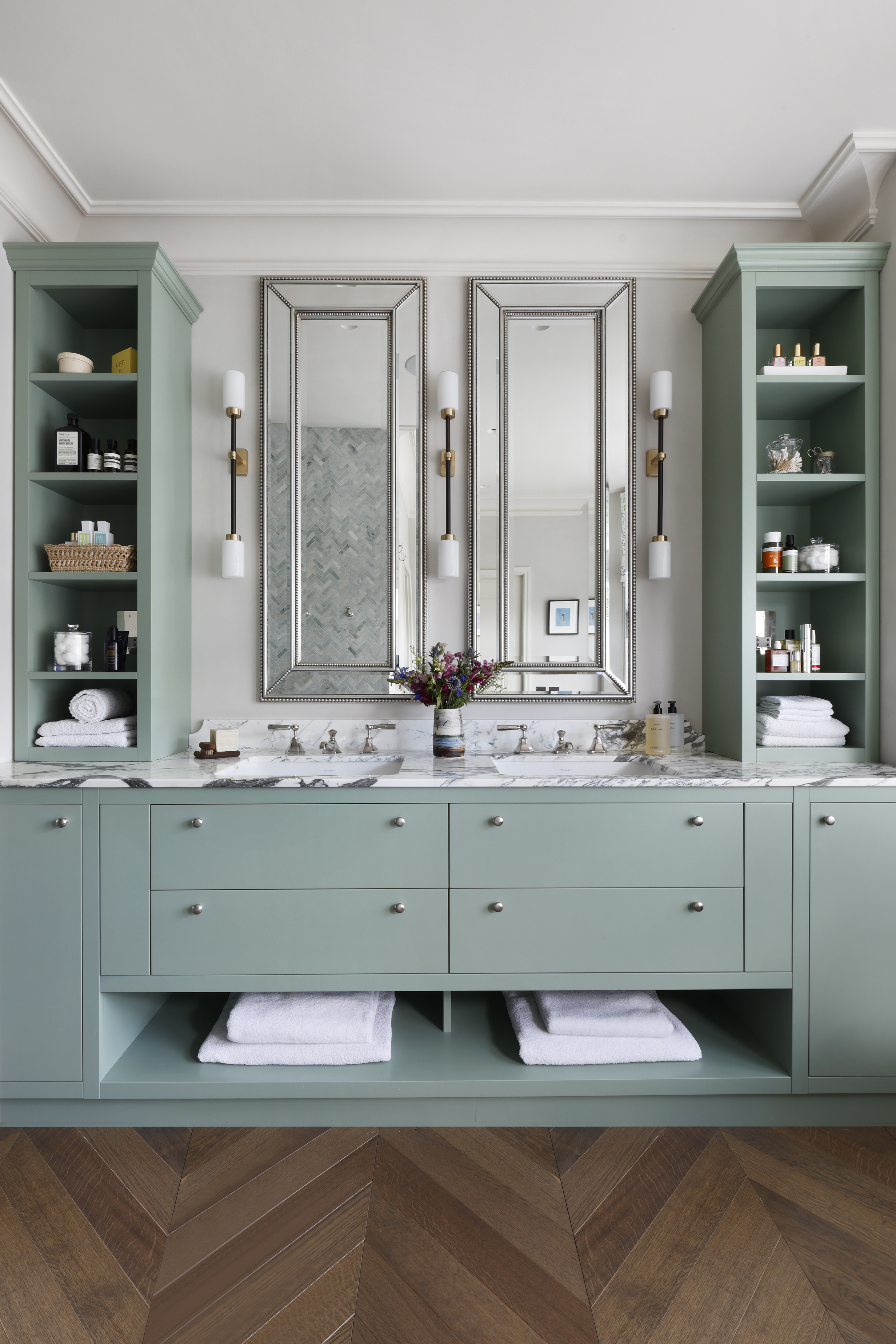 a bathroom painted in a turquoise and teal color palette