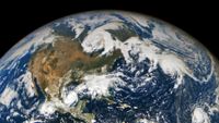 An image from space showing storm clouds across North America and the Atlantic