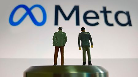 Meta logo and toy people figures