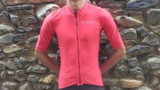 Image shows a rider wearing the Invani Cool Weather Reversible Jersey