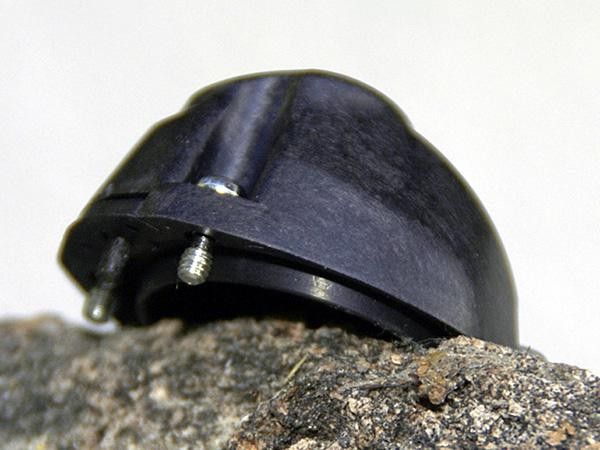 Shimano still uses tiny little screws to remove the stock plug but they're now captured so you can't lose them.