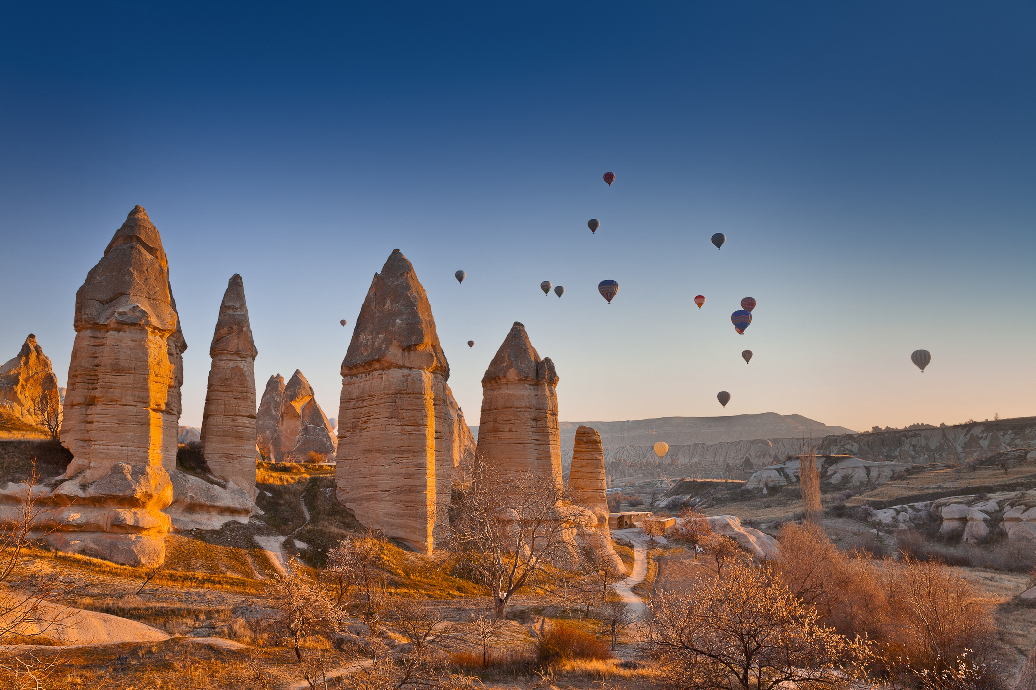 Balloons rising above the Love Valley in Cappadocia, Turkey