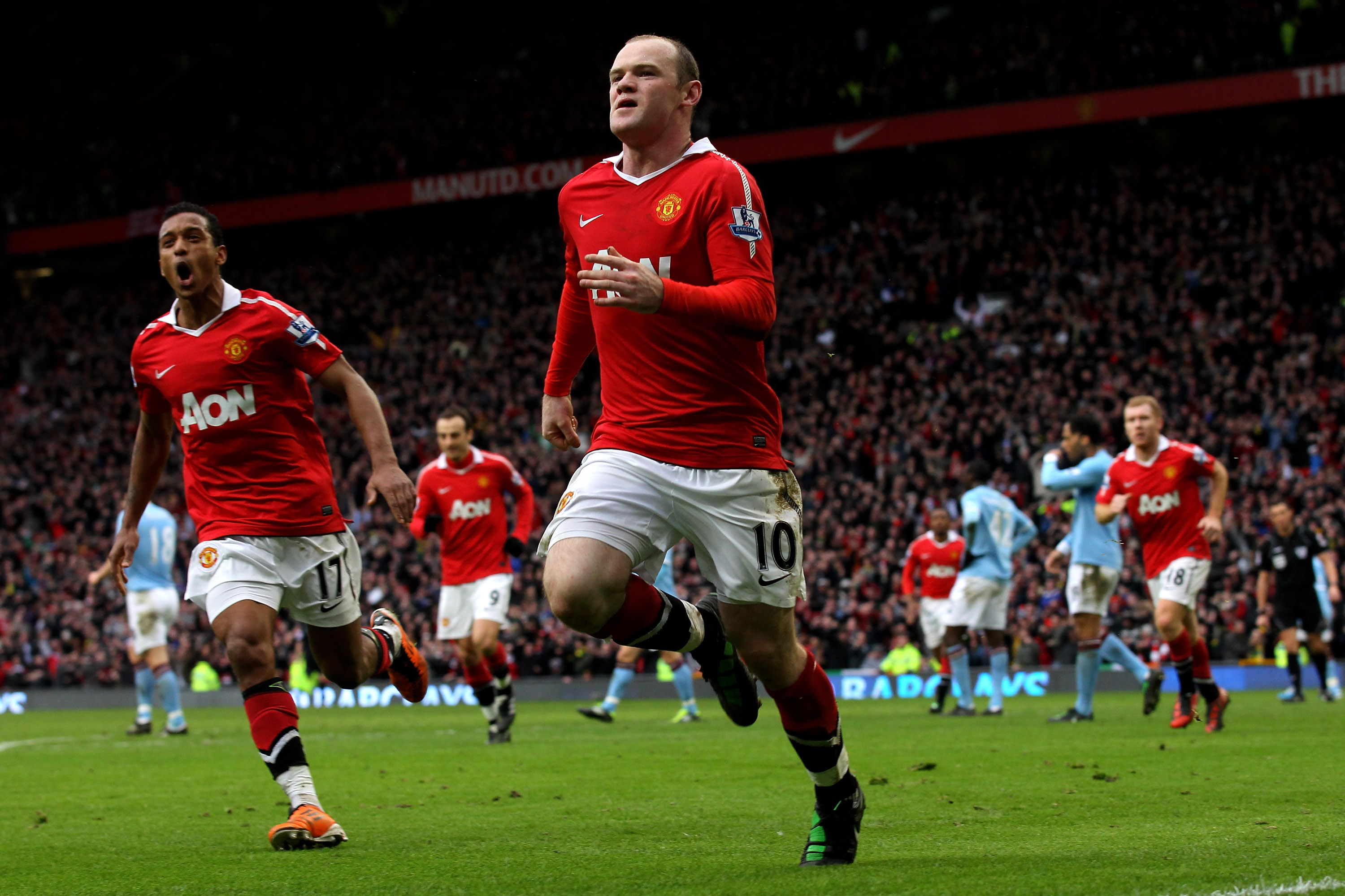 Wayne Rooney celebrates after scoring an overhead kick for Manchester United against Manchester City in February 2011.