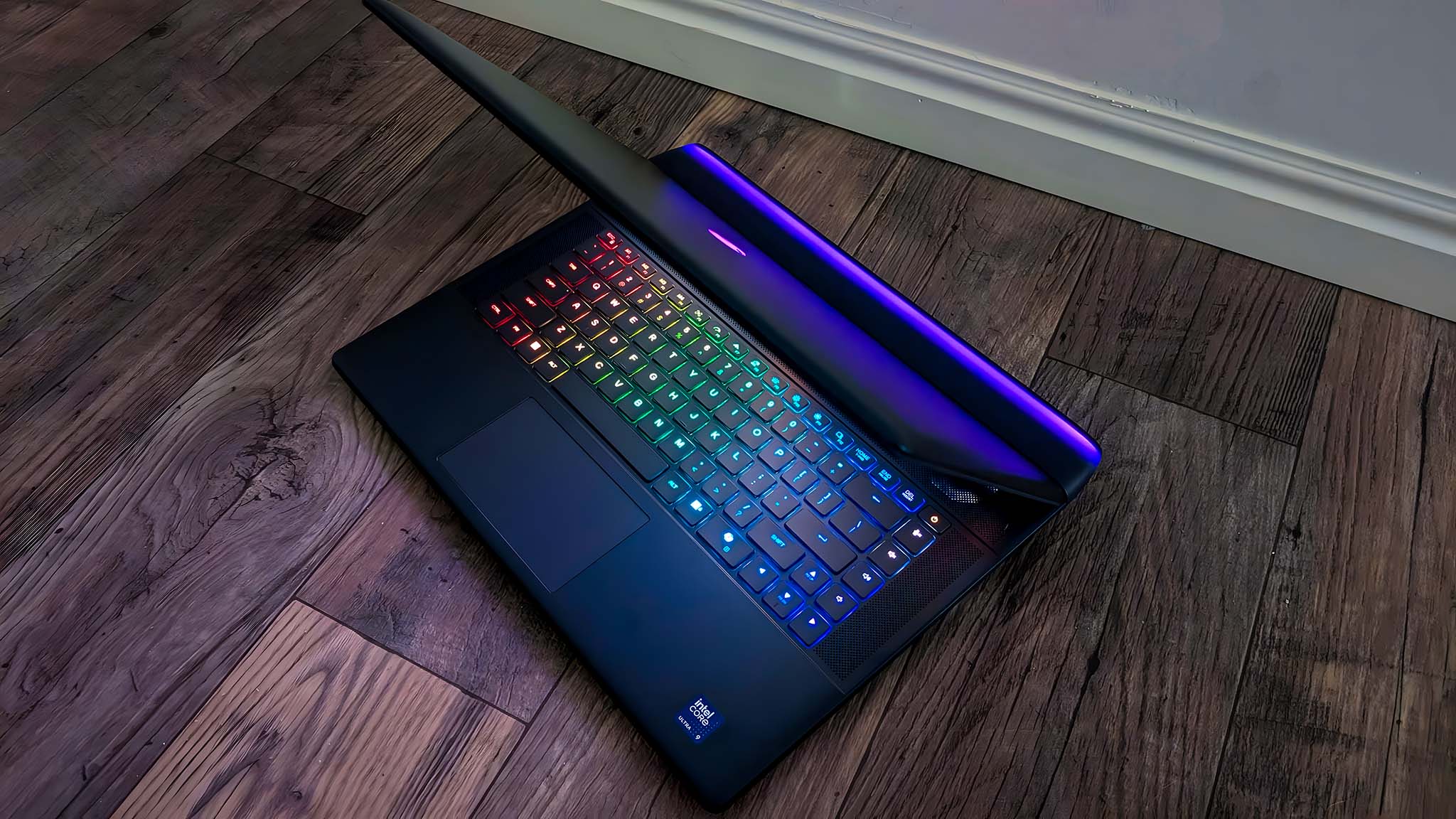 Alienware Area-51 16 Gaming Laptop on the floor and with the lid tipped forward to see the thermal shelf and keyboard at the same time.