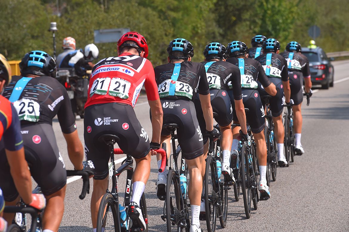 Chris Froome rolls along behind his teammates