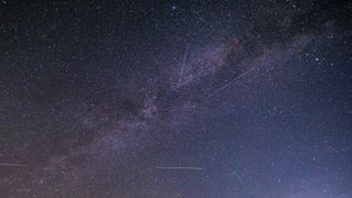 Night landscape over the mountain with colourful Milky Way sky dome, the cloudless sky at mountains with the starry sky with hills at summer with the beautiful Universe and Space background