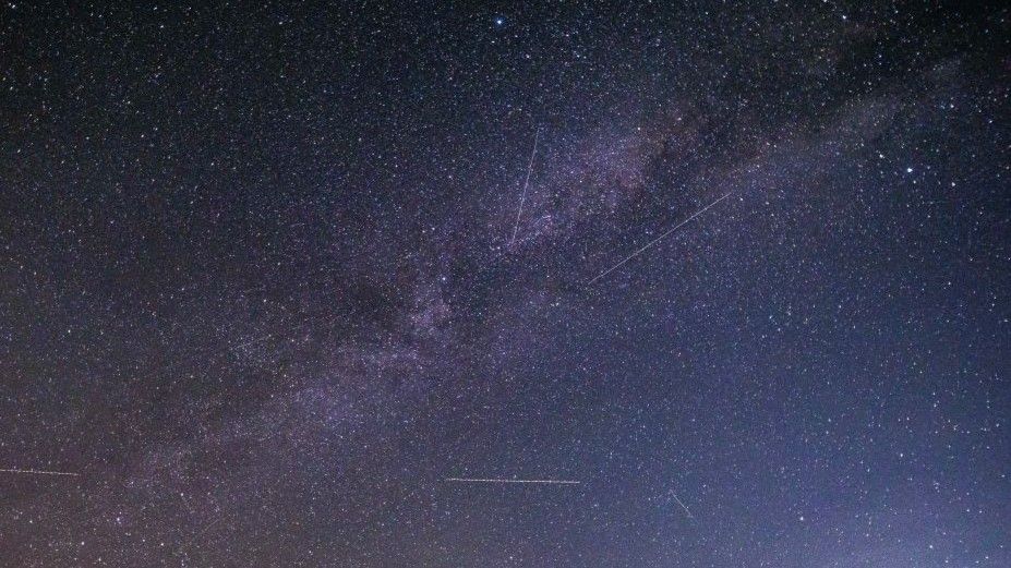 Night landscape over the mountain with colourful Milky Way sky dome, the cloudless sky at mountains with the starry sky with hills at summer with the beautiful Universe and Space background