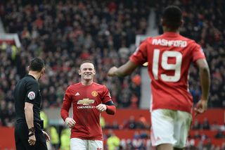 Manchester United's English striker Wayne Rooney (C) celebrates with Manchester United's English striker Marcus Rashford (R) after Rashford scored their third goal during the English FA Cup third round football match between Manchester United and Reading at Old Trafford in Manchester, north west England, on January 7, 2017. / AFP / Oli SCARFF / RESTRICTED TO EDITORIAL USE. No use with unauthorized audio, video, data, fixture lists, club/league logos or 'live' services. Online in-match use limited to 75 images, no video emulation. No use in betting, games or single club/league/player publications. / (Photo credit should read OLI SCARFF/AFP via Getty Images)