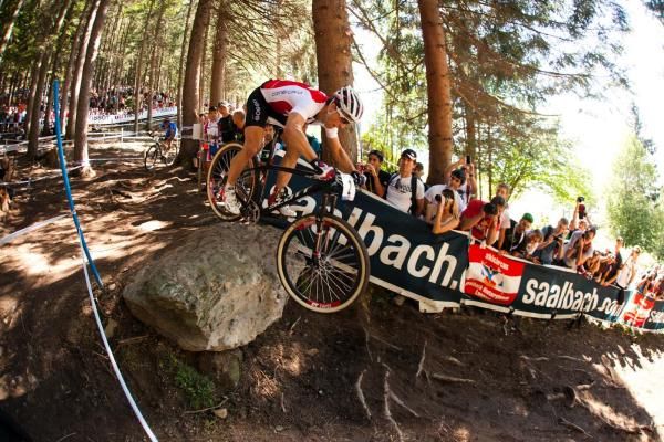 Nino Schurter (Switzerland) flies over the rock drop