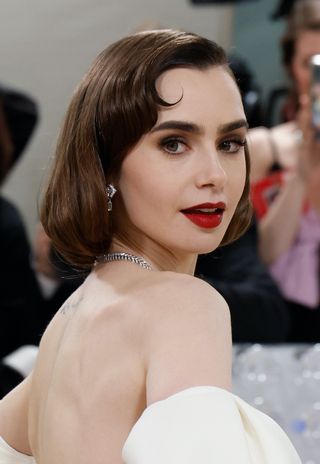 Lily Collins attends the 2023 Costume Institute Benefit celebrating "Karl Lagerfeld: A Line of Beauty" at Metropolitan Museum of Art on May 01, 2023 in New York City