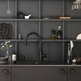 kitchen with black worktop and shelves