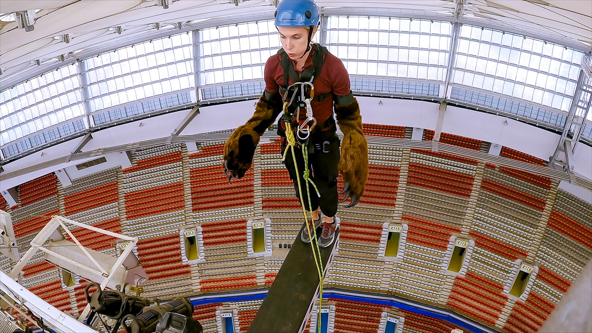 A contestant stands on the edge of a plank prepared to do a corded jump on The Amazing Race Season 39