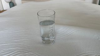 A glass of water on the TheraPur ActiGel Cool Mattress Topper