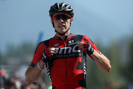 Rohan Dennis celebrates as he crosses the finish line to win stage four