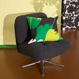 Black IKEA DYVLINGE armchair with graphic patterned cushion