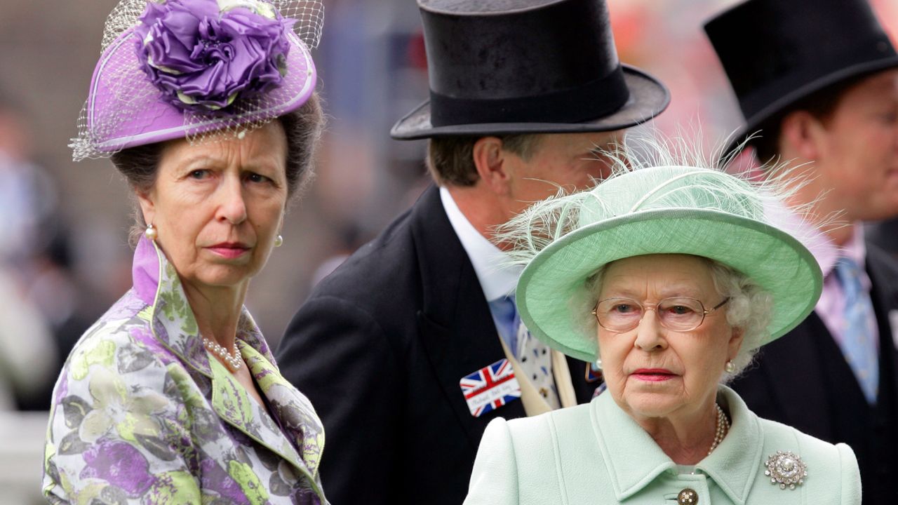 Princess Anne wears a purple hat and Queen Elizabeth II wears a pastel green hat to attend Ladies Day during Royal Ascot on June 21, 2012 