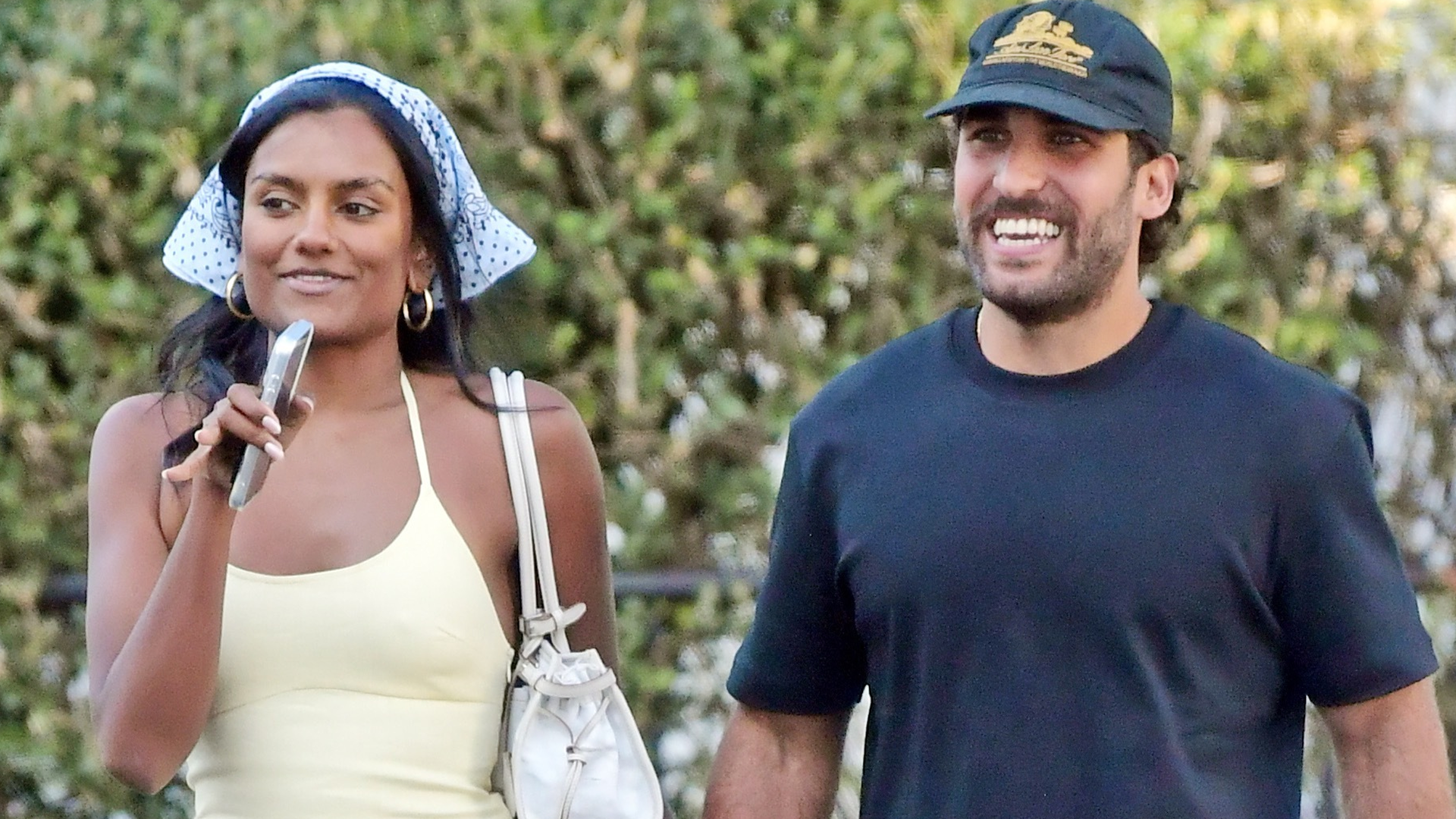 Simone Ashley styled a butter yellow summer dress with the bandana trend and Puma Speedcat sneakers