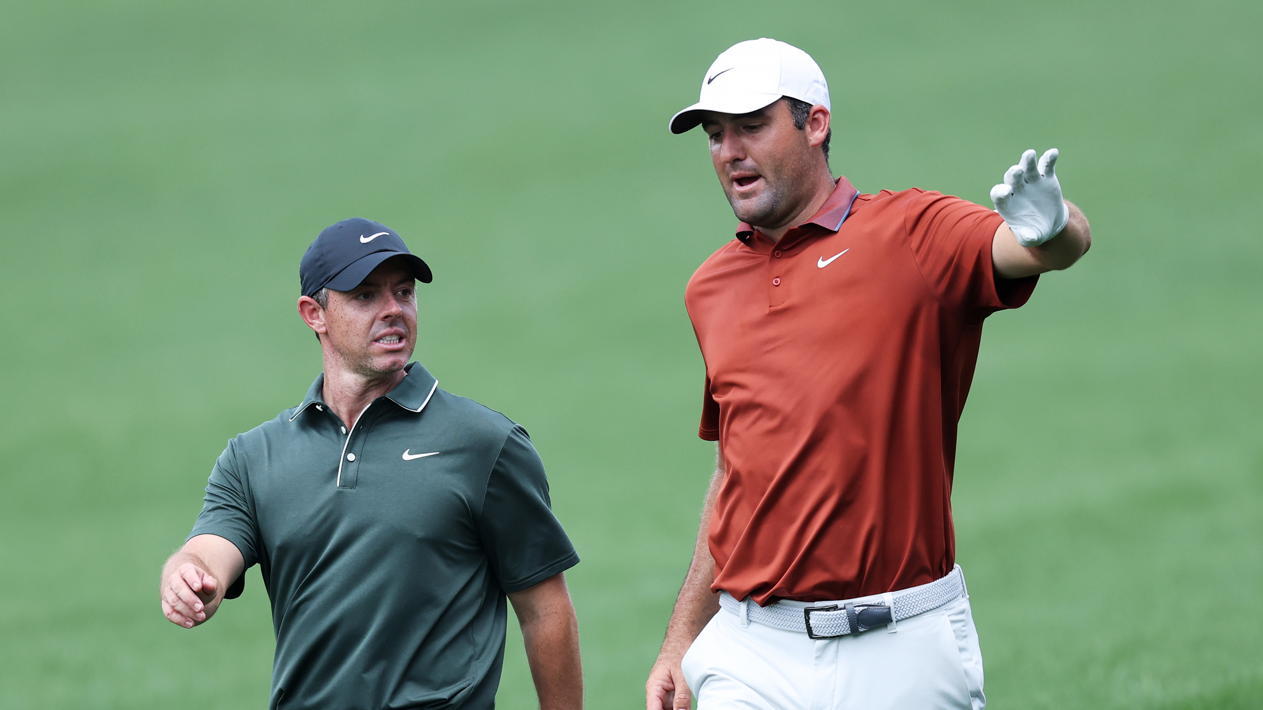 Rory McIlroy (left) and Scottie Scheffler chat during round one of the 2025 PGA Championship
