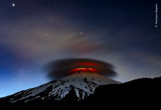 A double lenticular cloud is illuminated at nightfall by the lava emitted from the Villarrica volcano, Chile. Villarica is in the town of Pucón in the south of Chile. It’s one of the country’s most active volcanoes and last erupted in 2015. Francisco takes regular trips to Villarrica to monitor its activity. On this visit, he stayed nearby for 10 nights. He says every trip is “quite an adventure – never knowing what the volcano might surprise you with”. Some nights are calm, others furious as in this photograph, where the brightness of the crater illuminates the night sky.