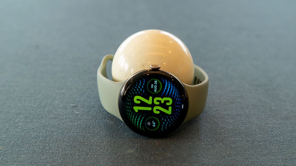 The Pixel Watch 5 around a billiard ball
