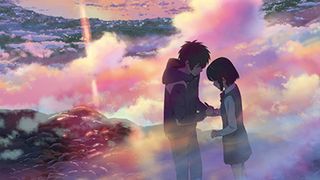 Two animated characters stand on top of a mountain during a colorful sunset