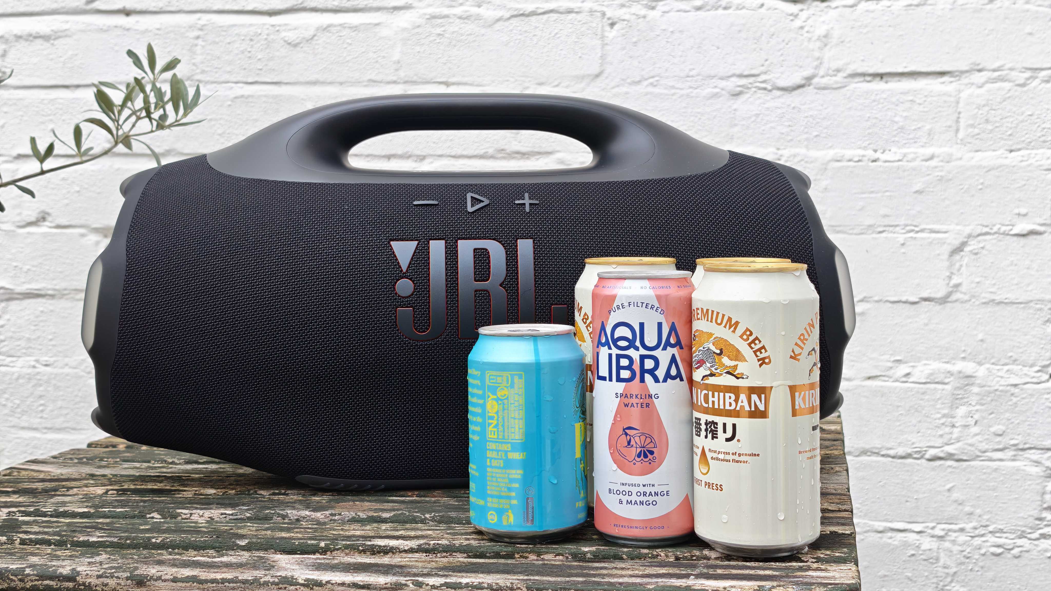 The JBL Boombox 4 on a table outside.