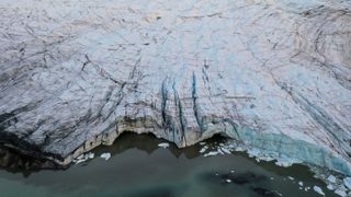 In this aerial view, icebergs and meltwater are seen in front of the retreating Russell Glacier on Sept. 8, 2021 near Kangerlussuaq, Greenland.