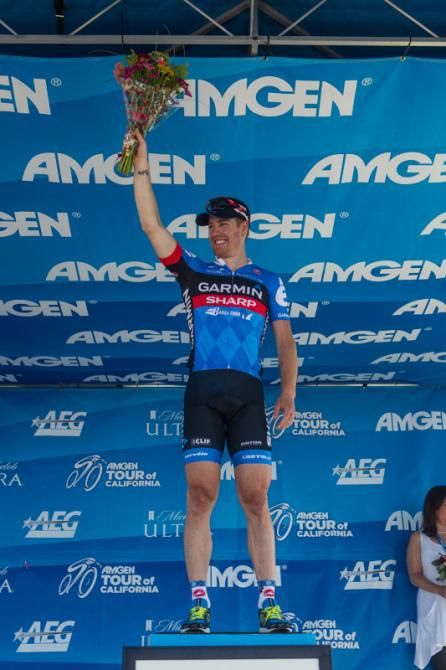 Tyler Farrar (Garmin-Sharp) takes the podium after his stage win.