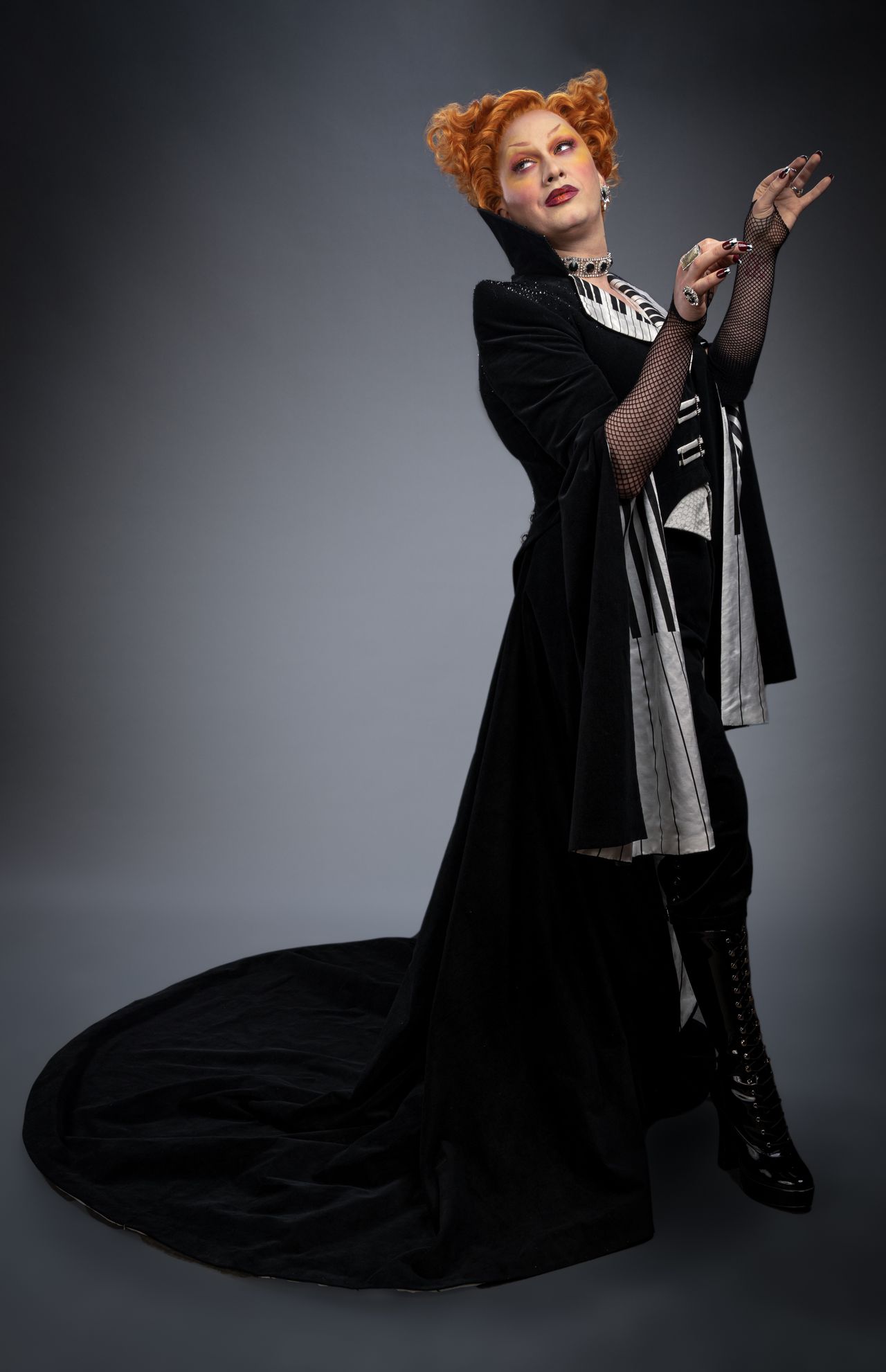 Jinkx Monsoon portrait in black robes as a Doctor Who villain