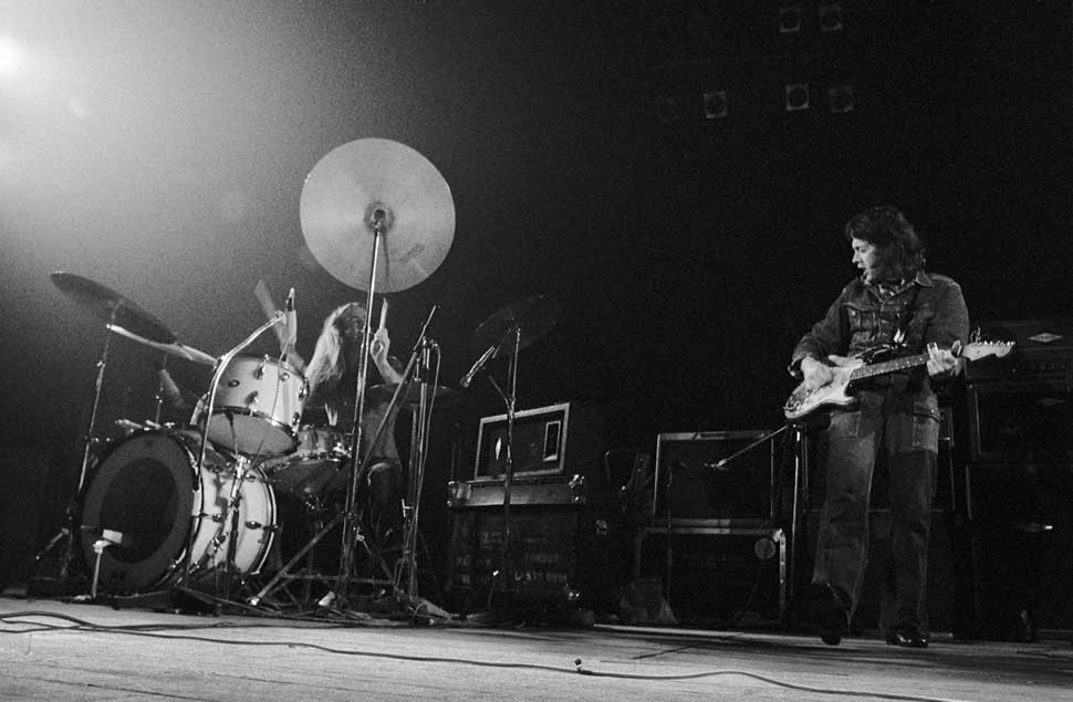 Rory Gallagher (1948-1995) performs live on stage with drummer Rod de'Ath in Rotterdam, Netherlands in 1974.
