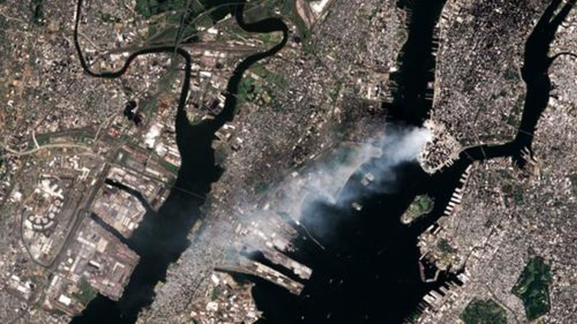 An additional satellite image showing smoke continuing to pour from Ground Zero on Sept. 12