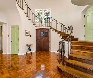Wooden floor and stairway, green doors