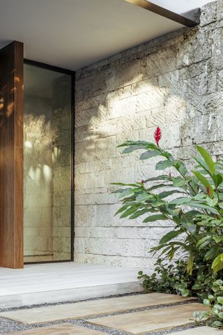 Stone framed front door at the Tarpon Bend Residence