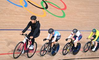 Riders behind a pacer during a heat of the women's track cycling keirin semifinals during the Tokyo 2020 Olympic Games 
